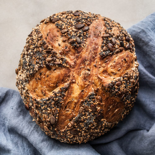 A few simple ingredients, no experience required for most amazing and beautiful bread you've ever made. You will be delighted by how truly easy it is to make this heavenly chewy, crispy crust, no-knead seed bread.