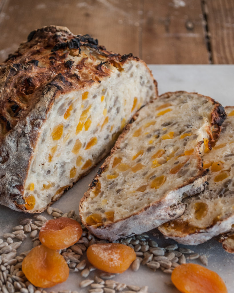 Easy Artisan Bread Recipe that anyone can make! Filled with apricot and sunflower kernels, or the fruit and nuts of your choice. Simple ingredients and easy to follow tutorial. Perfect for Holiday baking or Thanksgiving!