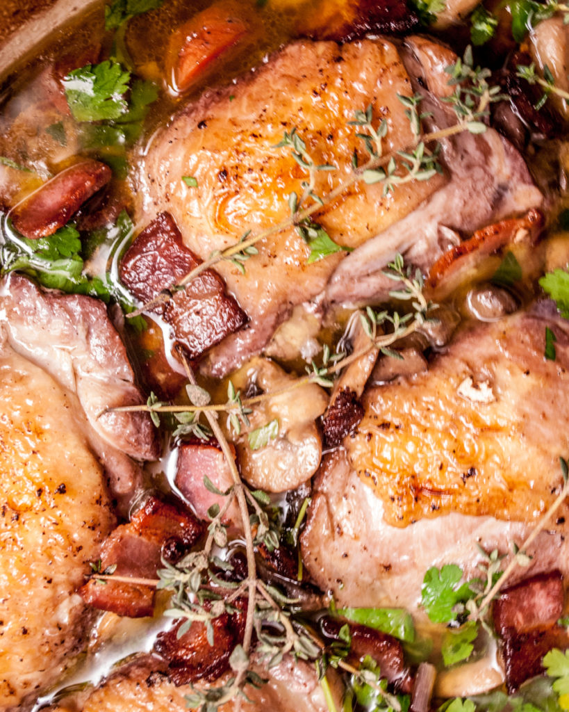 Chicken in red wine sauce, this rustic French classic dinner is full of flavor and a surprisingly easy dinner recipe to make!